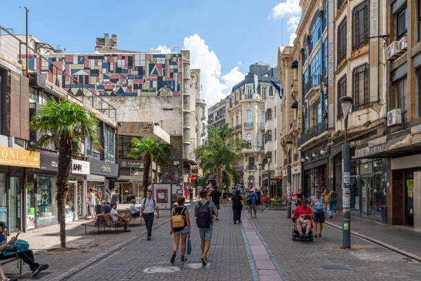 March 15, 2023 - A street scene in Montevideo, Uruguay. Locals and tourists navigate a busy street in the peak of summer.