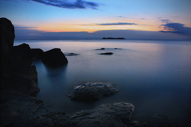 A long exposure photo of a sunset over the Río de la Plata, in Colonia del Sacramento, Uruguay